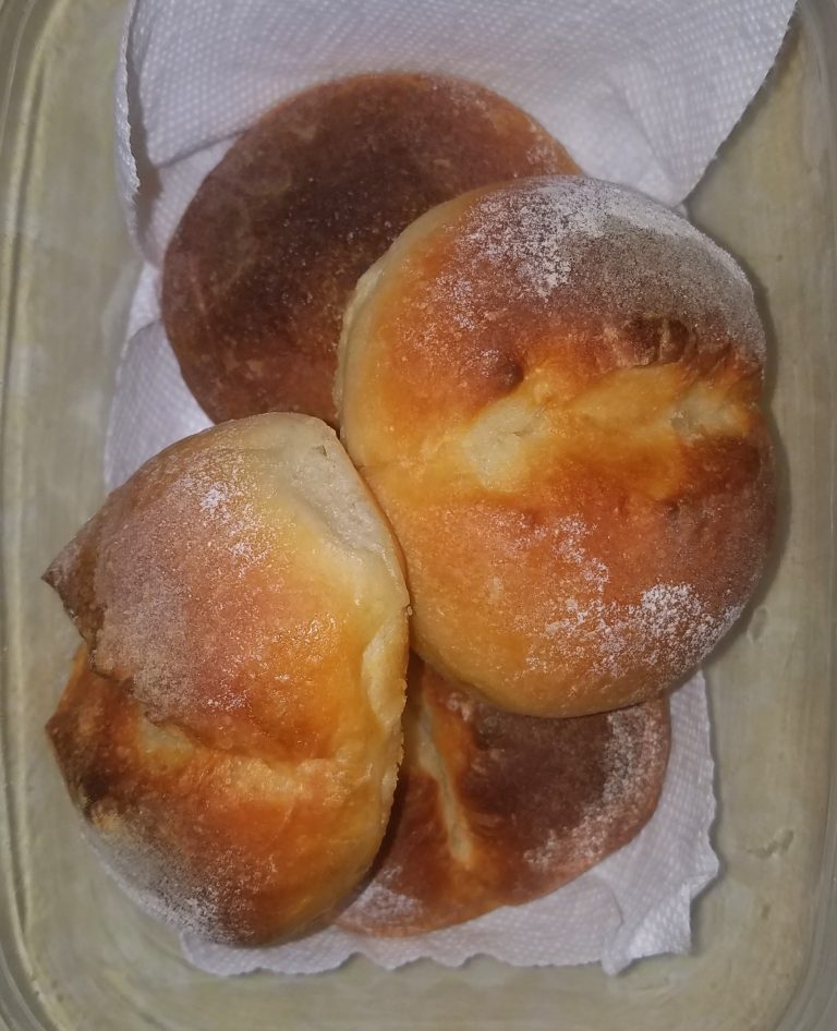 Homemade soft dinner rolls on a plate