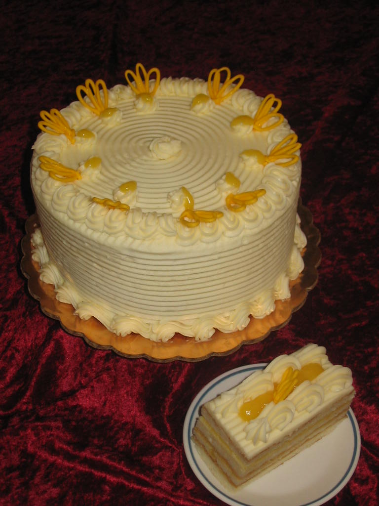 Sliced lemon loaf cake with bright lemon flavor and a light glaze