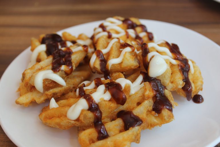 Crispy waffle fries served with dipping sauces